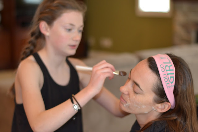 Mother and daughter spa at home with homemade face mask