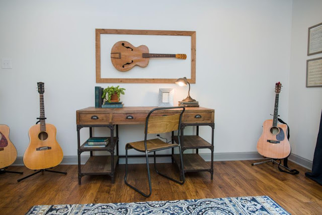 music room with guitars on display on fixer upper guitar room
