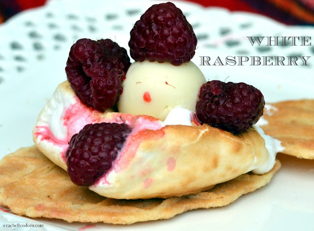 white raspberry Lindt truffle on a waffle cookie smore