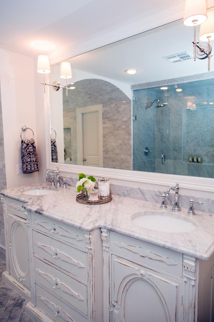 antique dresser used as a bathroom vanity in Fixer Upper home bathroom vanity