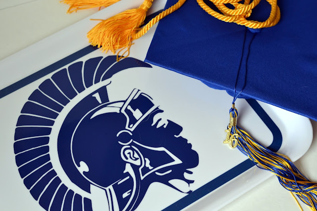Using a high school mascot cut out of vinyl to create a custom tray for a graduation party Using a high school mascot cut out of vinyl to create a custom tray for a graduation party